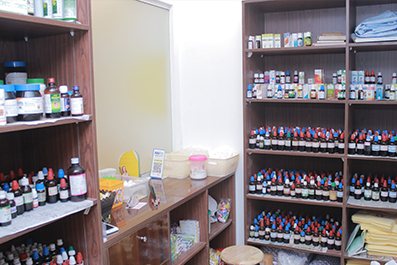 Homeopathic medicine shelves and dispensary inside Niveena Homeo Clinic in Chennai